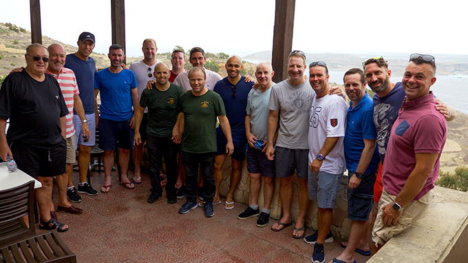 Man Utd players at Gozo beauty spot with restaurant owners. Photo by John Gubba