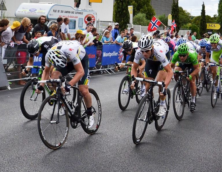 Mark Cavendish (green jersey), being led home in stage Stage 11, 2011 Tour de France.Source: wikipedia