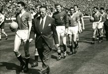 JimmYyMurphy leads out Manchester United's 1958 FA Cup Final team at Wembley flanked by Bill Foulkes (left) and Harry Gregg (behind him)