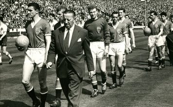JimmYyMurphy leads out Manchester United's 1958 FA Cup Final team at Wembley flanked by Bill Foulkes (left) and Harry Gregg (behind him)
