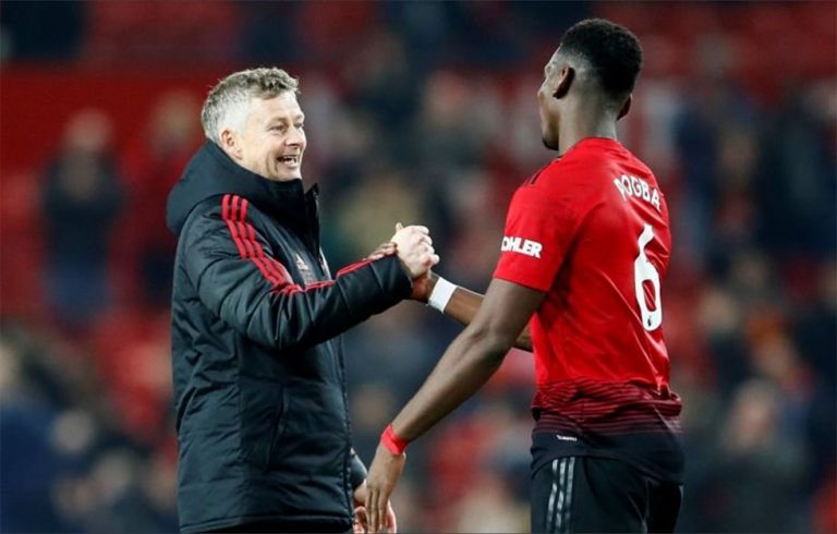 Ole Gunnar Solskjaer celebrates with Paul Pogba