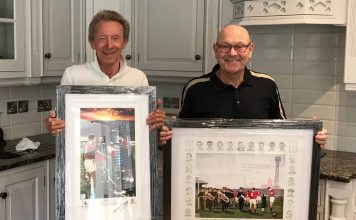 Denis Law and Alan Wardle with paintings for charity auction