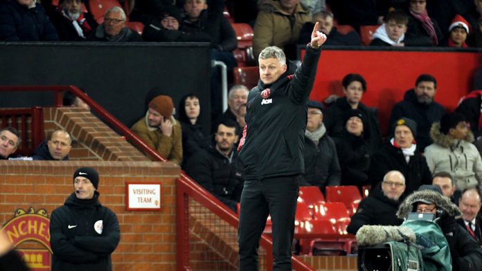 Ole Gunnar Solskjaer points the way in front of Old Trafford dugout